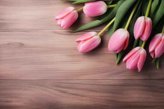 Bouquet of fresh beautiful delicate tulips on a wooden background as a gift, photo in light pastel colors, concept of Mother's Day, Women's Day, spring background, rustic style, copy space