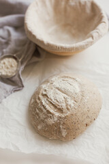 Fototapeta na wymiar Raw sourdough bread in banneton