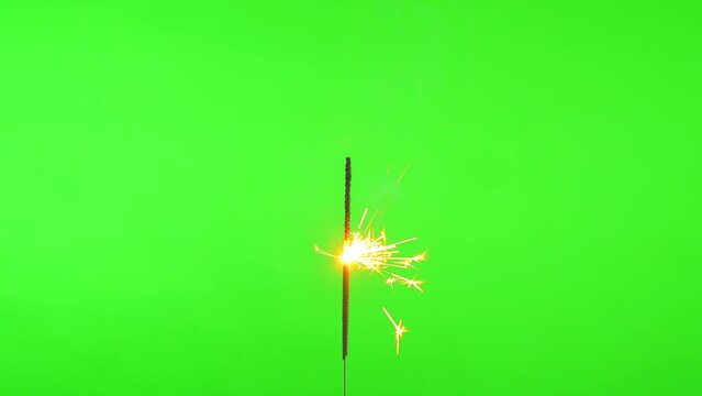 Close up sparkler fireworks on green screen background for celebrating