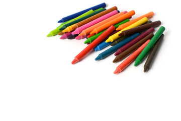 Crayons lined up isolated on white background.