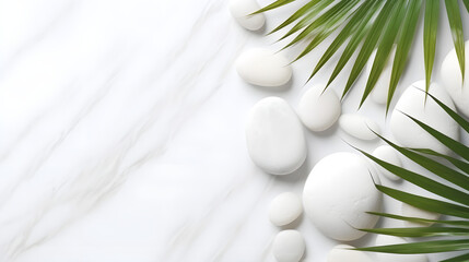 White background with  stones and palm branch, top view - obrazy, fototapety, plakaty