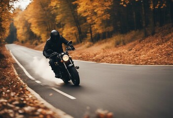 A motorcycle rider speeding on a autumn road