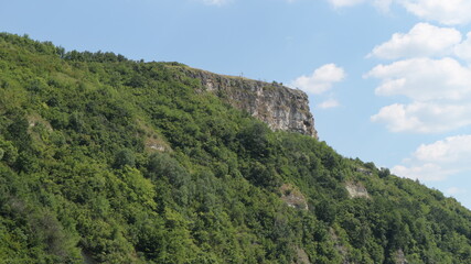 Observation deck above the canyon. The rocks are overgrown with dense forest.