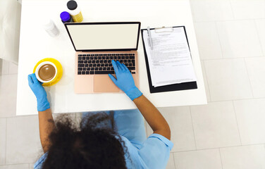 Shot of attractive afro female doctor talking while explaining medical treatment to patient through a video call
