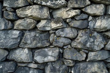 Stone wall covered with yellow lichens. Suitable for nature, texture, or background use
