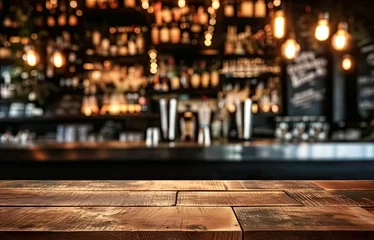 Zelfklevend Fotobehang Bar table interior in pub with wooden counter background desk space blurred light for drink design cafe top in coffee restaurant vintage retro style wine shop brown alcohol abstract blurry kitchen © Thares2020