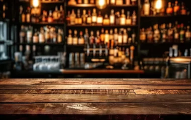 Muurstickers Bar table interior in pub with wooden counter background desk space blurred light for drink design cafe top in coffee restaurant vintage retro style wine shop brown alcohol abstract blurry kitchen © Thares2020
