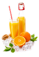 Orange juice in glass and bottle. Fresh orange fruits isolated