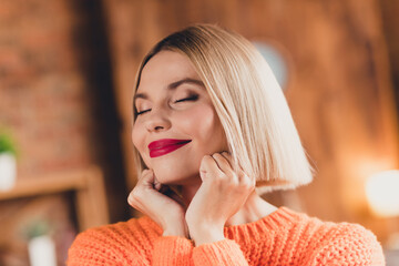 Close up photo of gorgeous positive young lady closed eyes hands touch cheeks pastime calmness...