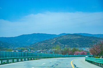Pingliang City, Gansu Province - Road and field scenery under the blue sky