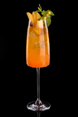 Frozen Peach Bellini cocktail summer drink.Black background.