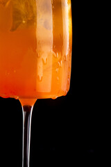 Frozen Peach Bellini cocktail summer drink.Black background.Closeup .Selective focus