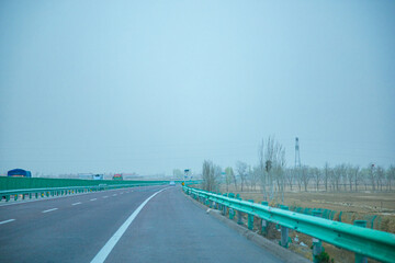 Pingliang City, Gansu Province - Road and field scenery under the blue sky