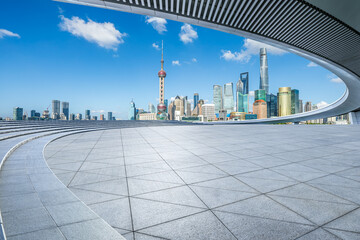 Empty square floor and pedestrian bridge with city buildings scenery in Shanghai