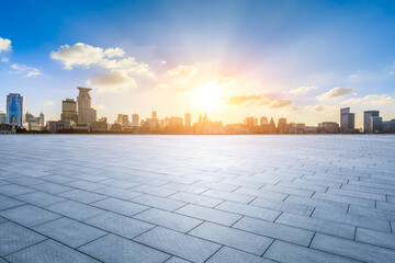 Empty square floor and city skyline with modern buildings scenery at sunset in Shanghai. Famous Bund landmark in Shanghai. - obrazy, fototapety, plakaty