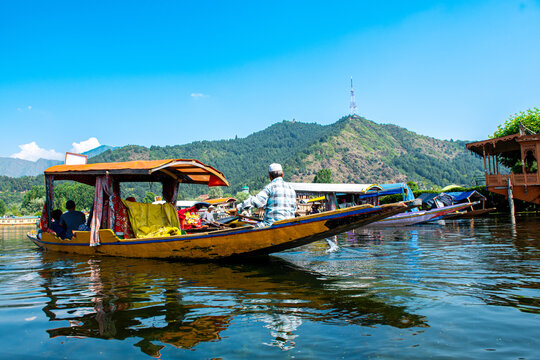 Dal Lake and the beautiful mountain range in the background, in the summer Boat Trip, of city Srinagar Kashmir India.