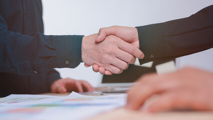 Fototapeta na wymiar Hand shake concept, businessman is shaking their hands together for greeting dealing business join venture or investment in successful business