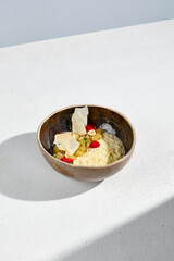 Millet porridge with stewed pear in a bowl, a warm and wholesome breakfast option