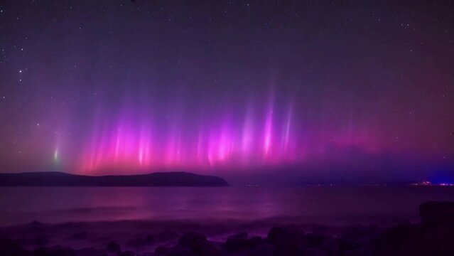 multi colour aurora in a clear night sky with twinkling stars