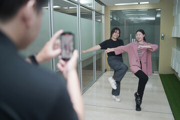 Asian vlogger female influencer dancing making video for having fun on social media IG story reel...