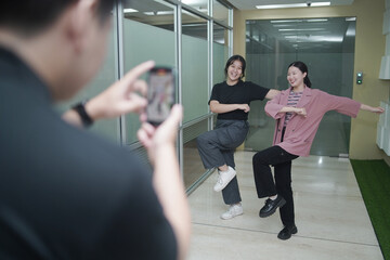 Asian vlogger female influencer dancing making video for having fun on social media IG story reel...