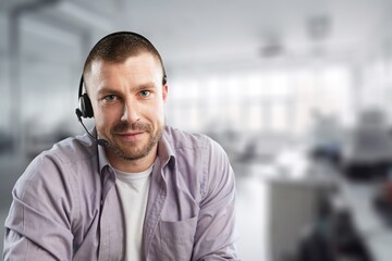 Technical support male operator working in office