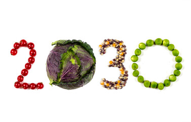 Happy New Year 2030 number made of fruits and vegetable on white