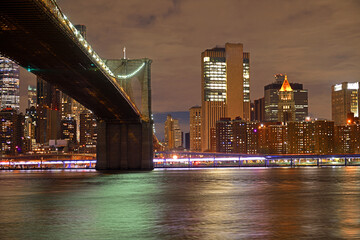 Night view of city. Manhattan and Brooklyn Bridge at night in winter. New York City, United States