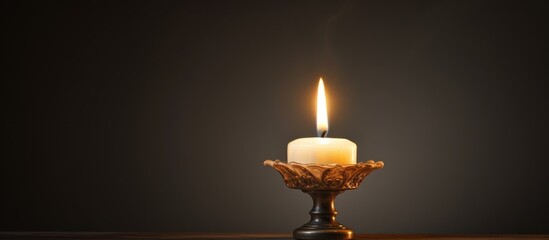 Fototapeta premium Light from a candle and its flickering glow.