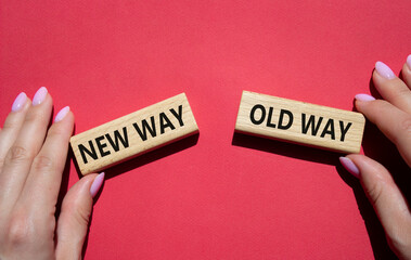 New Way or Old Way symbol. Concept word New Way or Old Way on wooden blocks. Businessman hand. Beautiful red background. Business and New Way or Old Way concept. Copy space
