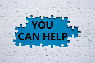 You can help symbol. Concept words You can help on white puzzle. Beautiful blue background....