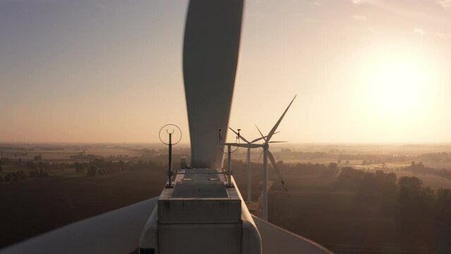Aerial view Wind turbines in a farm field up close beautiful sunrise