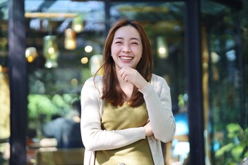 Fototapeta premium portrait of a smiling woman in cafe