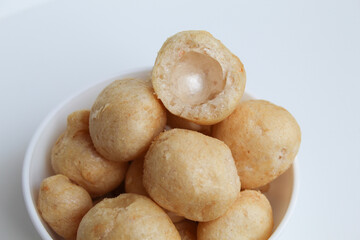 Bitten fish crackers in ball shape. isolated on white background