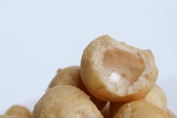 Bitten fish crackers in ball shape. isolated on white background