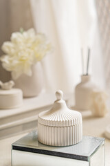 Fototapeta na wymiar White box for small items in the interior of a white room