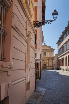 A Street in Parma and in the Background the deconsecrated Renaissance Church of San Marcellino, Italy