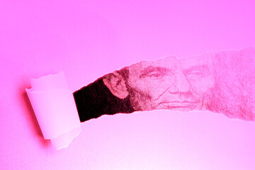 Torn paper with Portrait of U.S. president Abraham Lincoln