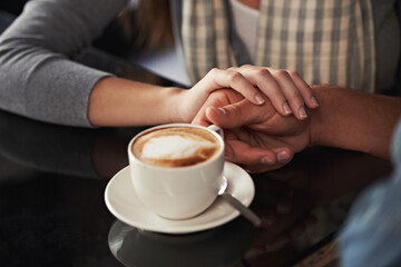 Coffee cup, cafe and relax couple holding hands for support, comfort or love on morning date with caffeine beverage. Wellness, marriage partner or closeup of people bonding over restaurant drink
