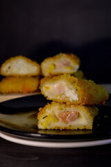 The Indonesian version of risoles or risoles is filled with mayonnaise, sausage, corn and boiled egg wrapped in a crepe-like wrapper and coated in breadcrumbs and deep-fried. selected focus.