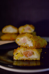 The Indonesian version of risoles or risoles is filled with mayonnaise, sausage, corn and boiled egg wrapped in a crepe-like wrapper and coated in breadcrumbs and deep-fried. selected focus.