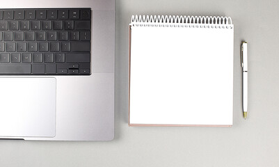 Close up of laptop keyboard and notebook, copy space