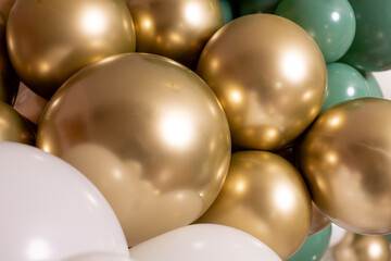 Background of gold, red and white inflatable gel balloons