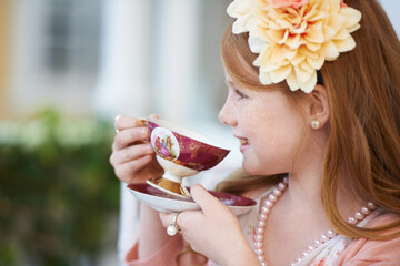 Girl, child and happy with tea in garden with party for birthday, celebration and playing outdoor...