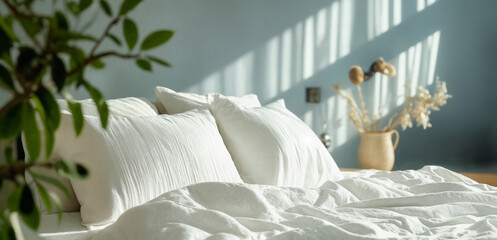  A nicely made white bed with pillows and linen, with a large window letting in sunlight. - obrazy, fototapety, plakaty