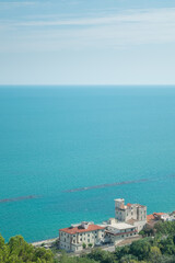 View of a turquoise water beach against sky