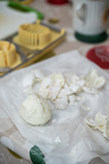 Peeled chicken eggs on white paper.