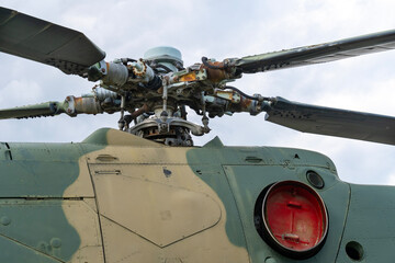 Old Soviet-made camouflage Mi-24 military helicopter propeller	
