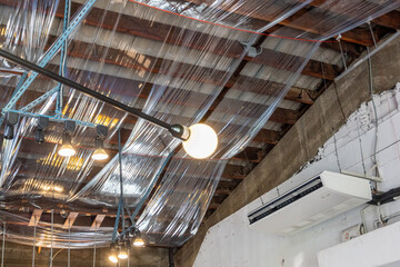 Vintage light bulb at Modern fashionable brand interior of clothing store.