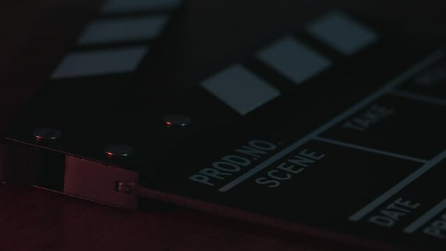 Video of clapperboard on a table in a local film production. Concept of film and video industry.